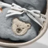 Steiff Geschenkset Lio Pinguin mit Rassel und Latz im Korb